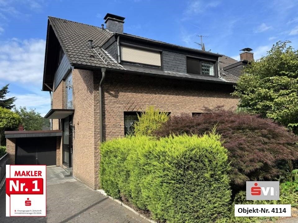 Teilvermietetes Zweifamilienhaus mit Doppelgarage und Garten in bevorzugter Lage von Königshardt Teilvermietetes Zweifamilienhaus mit Doppelgarage und Garten in bevorzugter Lage von Königshardt